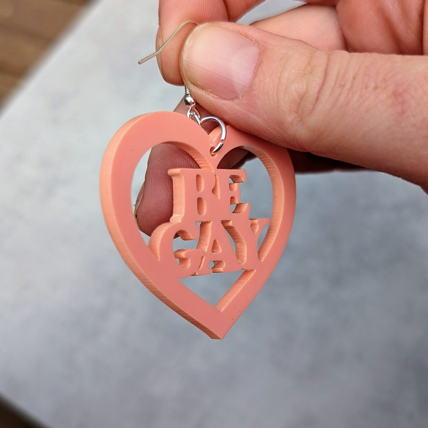 Be Gay acrylic earring set.