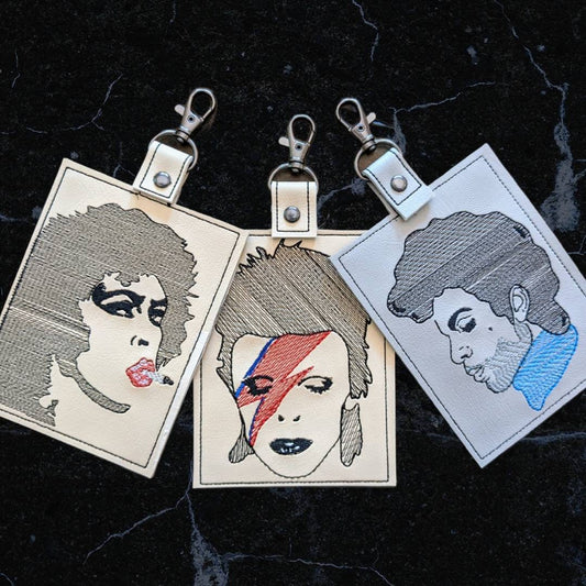 Holy Trinity vaccination card protector. Attach to purse, bag, backback or beltloops Vinyl, cork, leather.