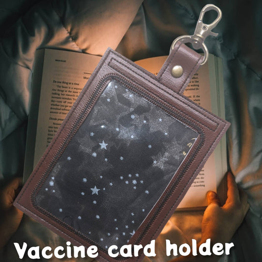 Neverending story vaccine card protector. Attach to purse, bag, backpack or beltloops Vinyl, vegan leather.