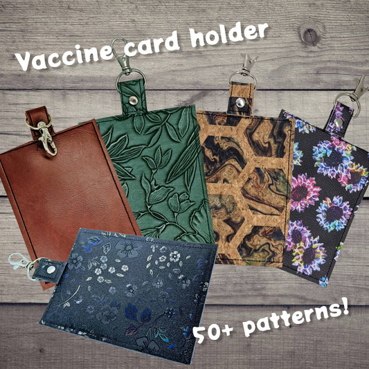 Sleek vaccination card/ID protector. Space for ID, cash, valuables. Attach to purse, bag, backback or beltloops Vinyl, cork, leather.