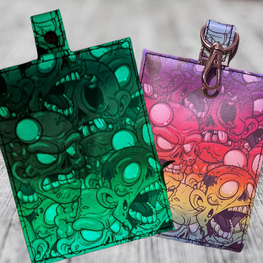 Glow in the dark! Zombies vaccine card protector. Attach to purse, bag, backpack or beltloops Vinyl, vegan leather.