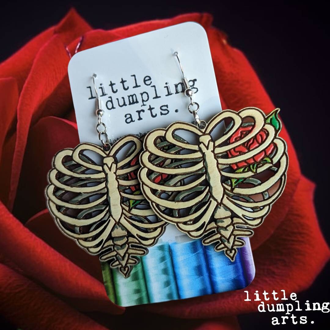 hand painted rib heart wooden earrings. sterling silver french hooks