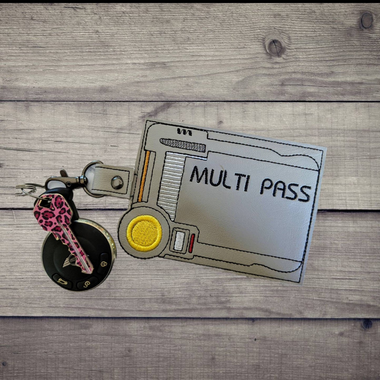Compact Multipass vaccination card protector. Attach to purse, bag, backback or beltloops Vinyl, cork, vegan leather