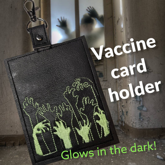 Braaiins glow in the dark vaccination card protector. Space for valuebles. Attach to purse, bag, backback or beltloops Vinyl, cork, leather.