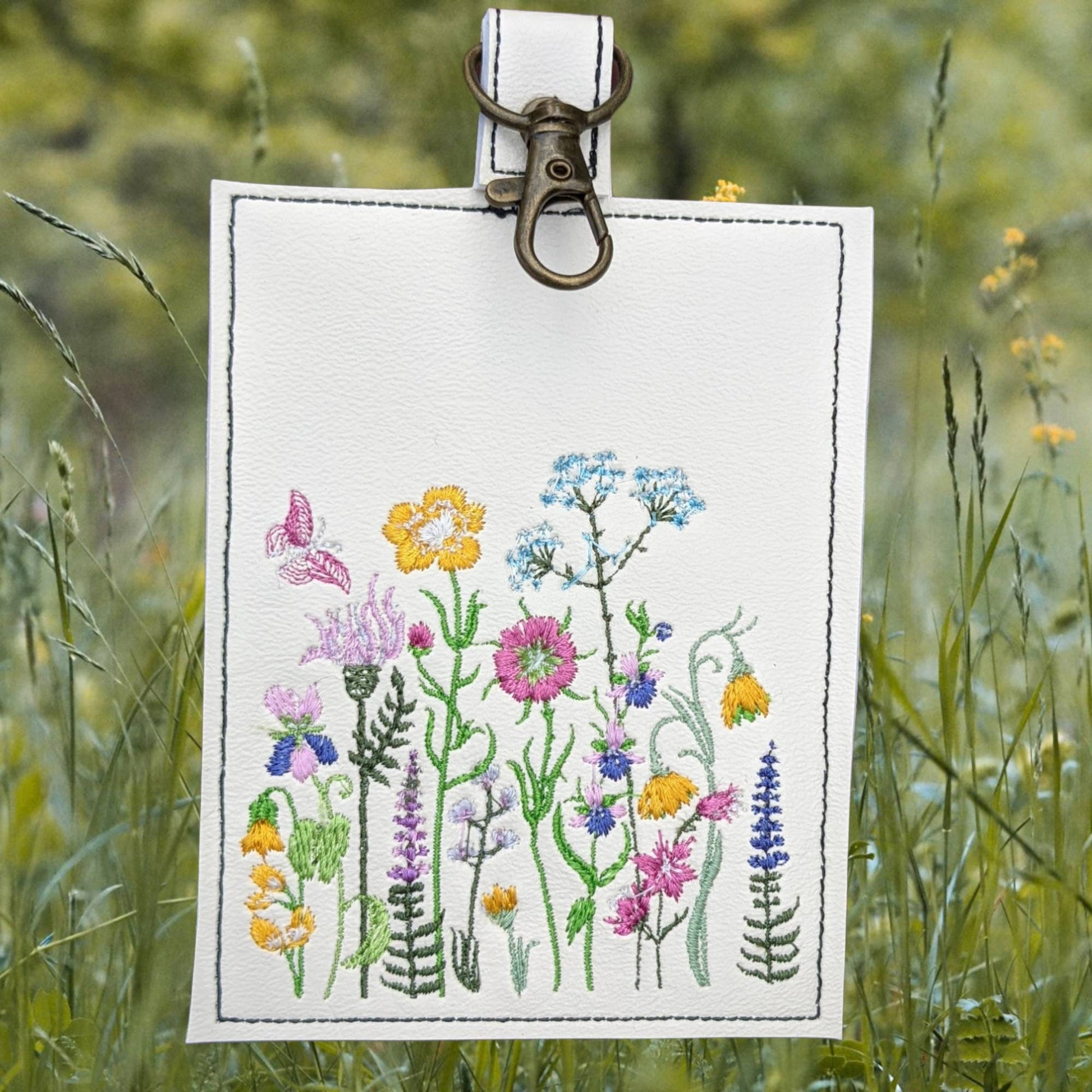 Wildflower vaccination card protector. Attach to purse, bag, backback or beltloops Vinyl, cork, leather.