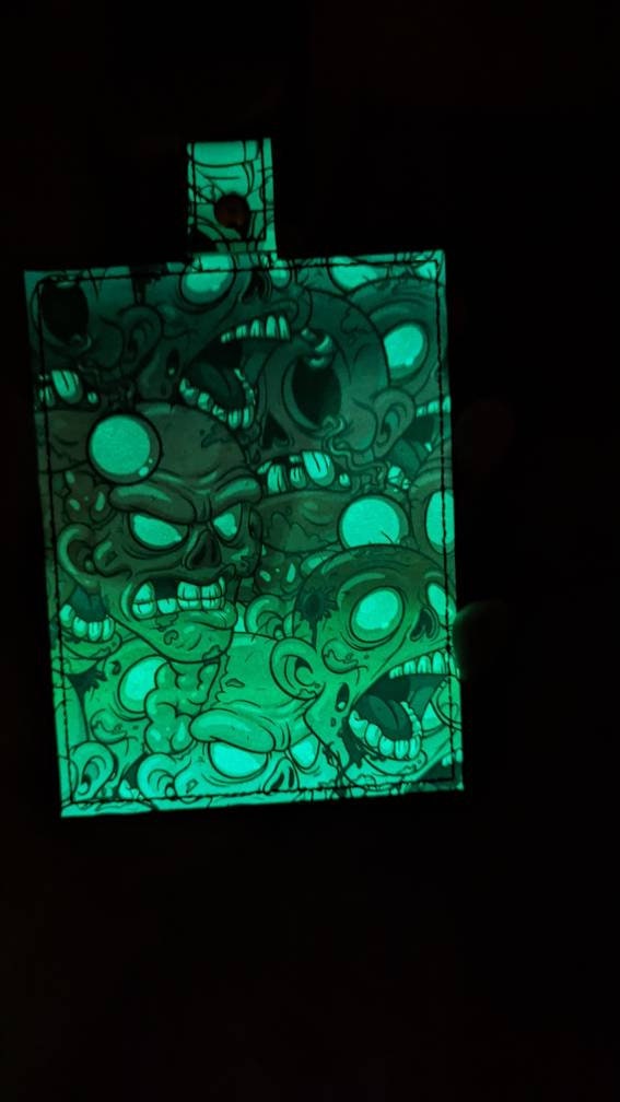 Glow in the dark! Zombies vaccine card protector. Attach to purse, bag, backpack or beltloops Vinyl, vegan leather.