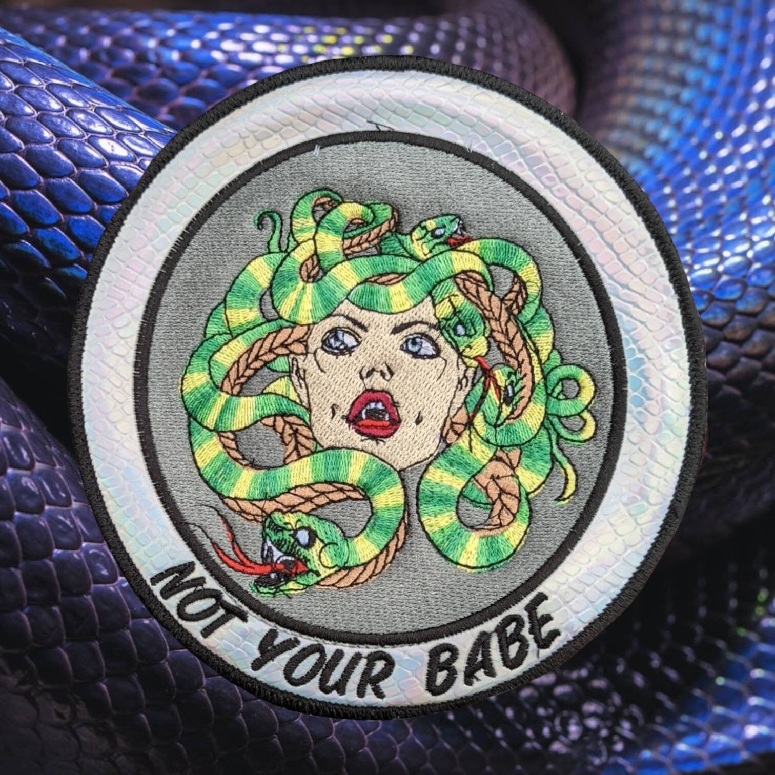 Not your babe Medusa patch on snakeskin vinyl.  sewn on 6 inches