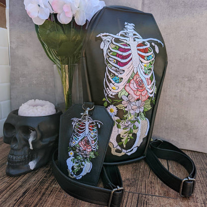 Floral rib coffin backpack with  zipper front slip pocket. Ready to ship! Vegan leather. Full embroidery. convertible to crossbody