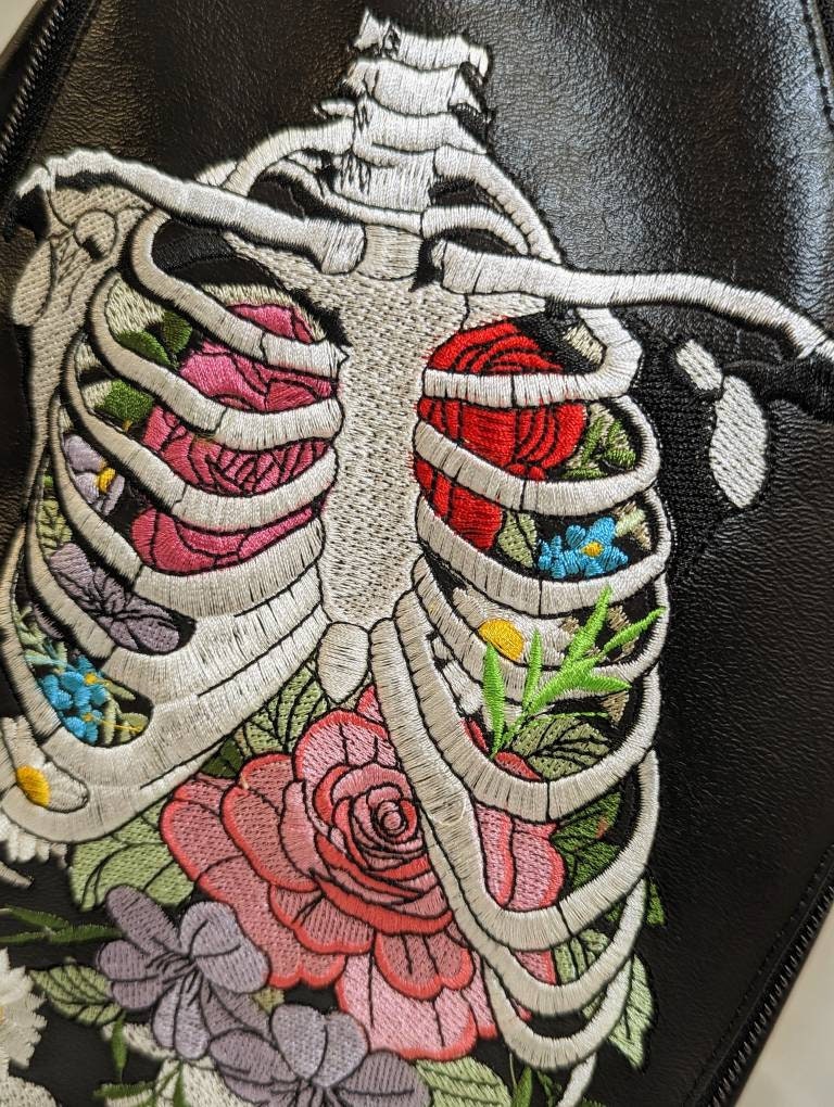 Floral rib coffin backpack with  zipper front slip pocket. Ready to ship! Vegan leather. Full embroidery. convertible to crossbody