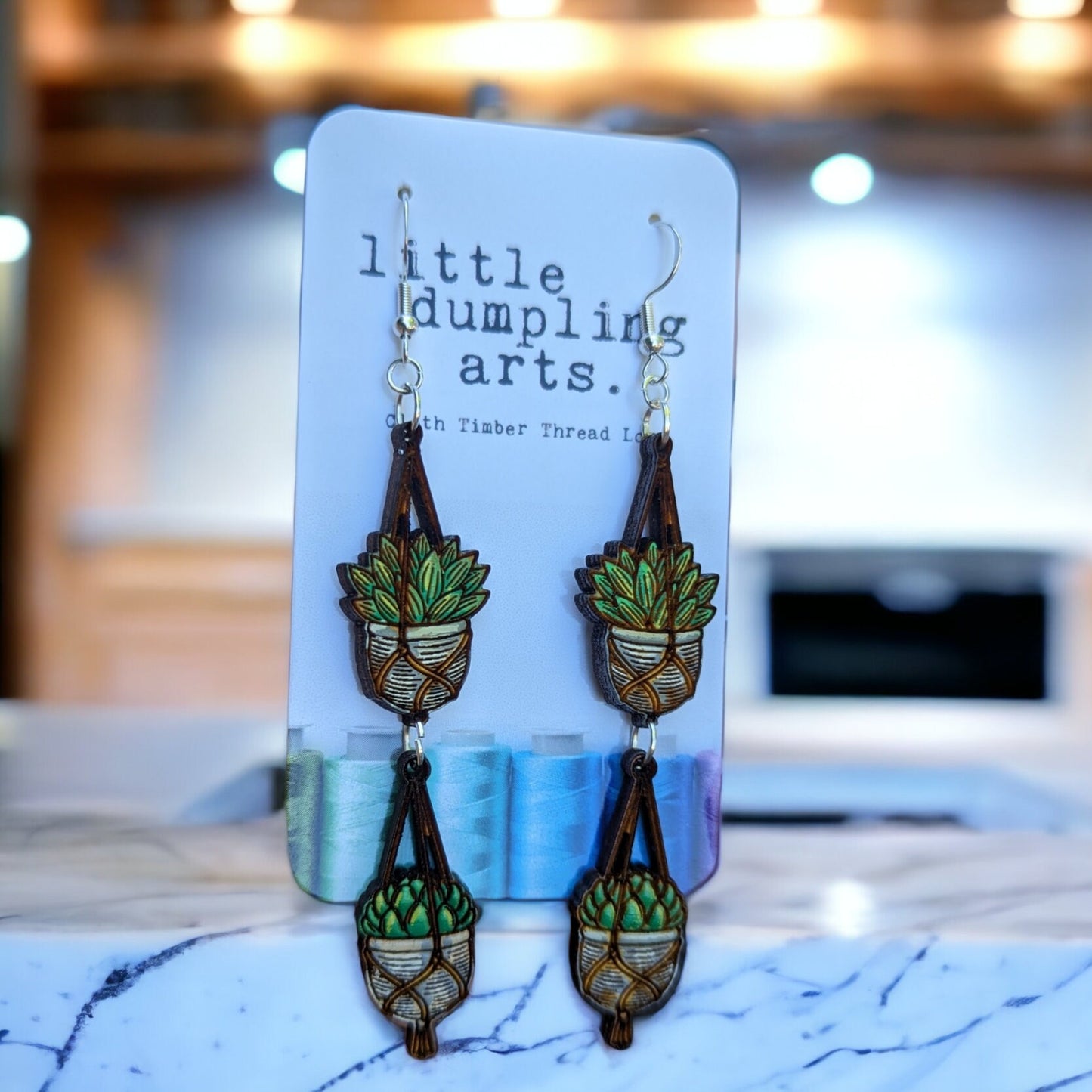 Hand painted hanging plant jointed earrings. Sterling silver hardware